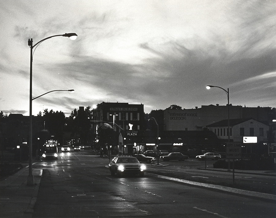 Black and White Traditional Photo of Evocotive Urban Street and Evening Sky.